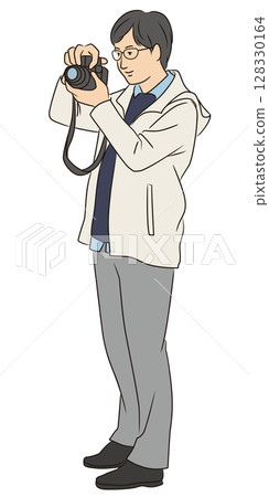 Young man holding a camera Young man holding a camera 128330164