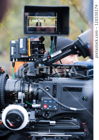 Capturing the Moment: A Professional Film Camera in Action During a Shoot with a Framed Subject on Screen Highlighting Cinematic Techniques and Equipment Use 128330174