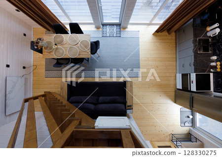 Stylishly Designed Open-Concept Living Area with Elegant Dining Table and Cozy Seating Arrangement in a Bright, Minimalist Home Space Featuring Modern Aesthetics 128330275