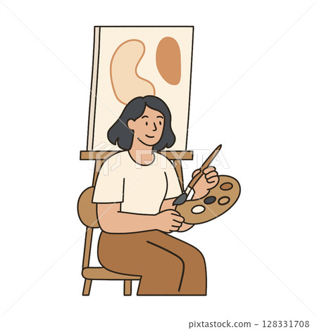 Woman painting on canvas with palette in her hand, expressing creativity and joy 128331708