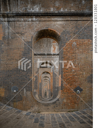 The semi-circular arches vaulting supporting traditional red brick piers with smooth limestone. 128331801