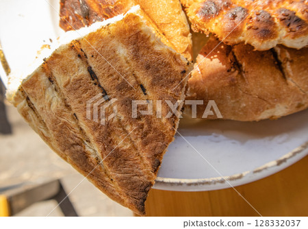 Bits of delicious toasted flatbread on a plate, top view, Asian oriental cuisine 128332037