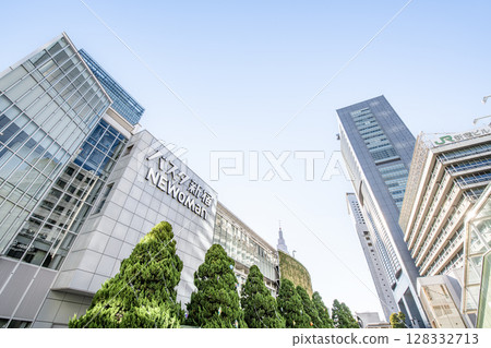JR Shinjuku Station (Busta Shinjuku) and JR East Headquarters Building on a clear day in Shinjuku, Tokyo 128332713