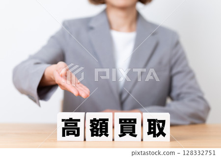 A middle-aged female business woman wearing a suit and a block of high-value purchases 128332751