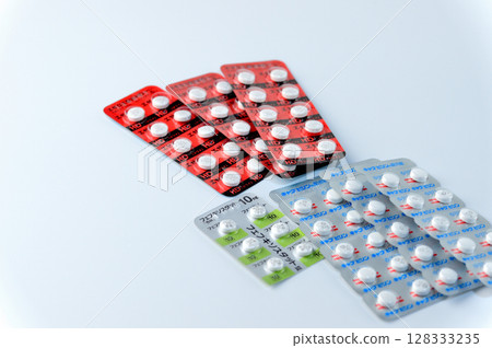 Medicine tablets on white background Medicine tablets on white background 128333235