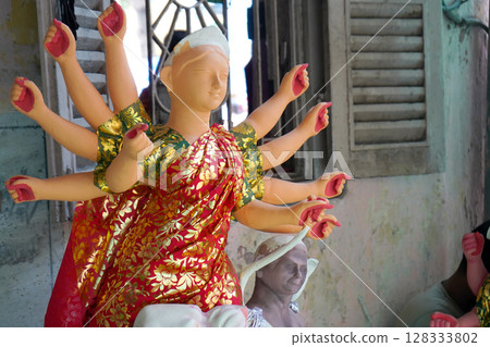 Close-Up of Partially Decorated Durga Idol in Artisan Workshop at Kumartuli Kolkata Close-Up of Partially Decorated Durga Idol in Artisan Workshop at Kumartuli Kolkata 128333802