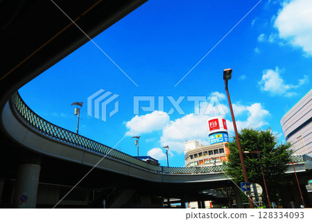 A view of the blue sky and buildings in front of the station from under the pedestrian deck in front of the east exit of Kawaguchi Station in Kawaguchi City, Saitama Prefecture A view of the blue sky and buildings in front of the station from under the pedestrian deck in front of the east exit of Kawaguchi Station in Kawaguchi City, Saitama Prefecture 128334093