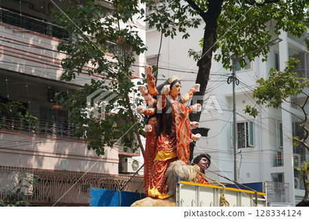 Transporting a Fully Decorated Durga Idol from Kumartuli to pandal 128334124