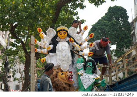 14th October 2023, Kumartuli, Kolkata, West Bengal, India. Daaker Saaj Durga Idol on Truck Amidst Puja Preparations at Kumartuli 128334249
