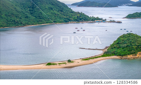 July 5 2025 Scenic View of Green Islands in a Beautiful Blue Sea by Mountains 128334586