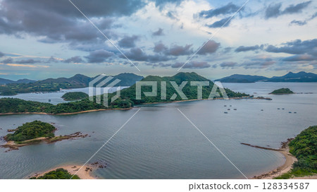 July 5 2025 Scenic View of Green Islands in a Beautiful Blue Sea by Mountains July 5 2025 Scenic View of Green Islands in a Beautiful Blue Sea by Mountains 128334587