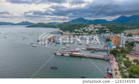 July 5 2025 Scenic Coastal Town by the Harbor with Boats and Hills 128334595