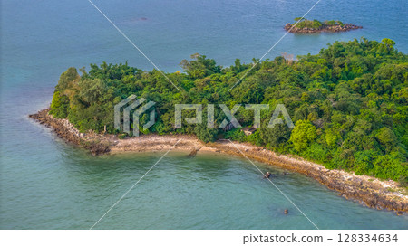July 5 2025 View of Lush Tropical Island Surrounded by Blue Waters 128334634