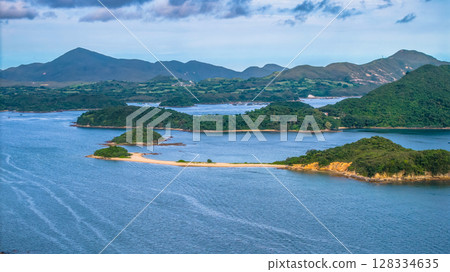 July 5 2025 Scenic View of Green Islands in a Beautiful Blue Sea by Mountains July 5 2025 Scenic View of Green Islands in a Beautiful Blue Sea by Mountains 128334635