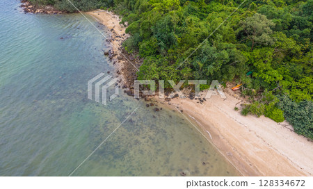 July 5 2025 Beach With Green Vegetation Surrounded by Blue Ocean Waters 128334672