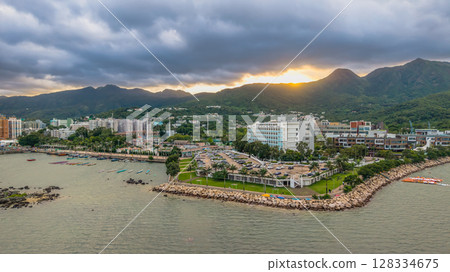 July 5 2025 Coastal Town with Mountainous Backdrop and Ocean Waters July 5 2025 Coastal Town with Mountainous Backdrop and Ocean Waters 128334675
