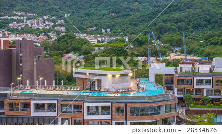 July 5 2025 Modern Building With Rooftop Pool Overlooking Scenic Greenery July 5 2025 Modern Building With Rooftop Pool Overlooking Scenic Greenery 128334676