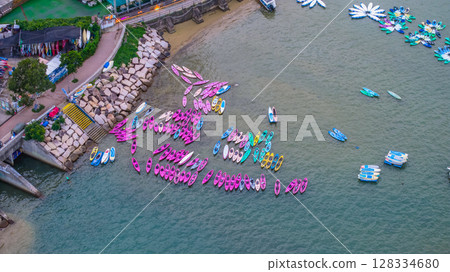 July 5 2025 Colorful Kayaks Docked Near a Waterfront in Vibrant Setting 128334680