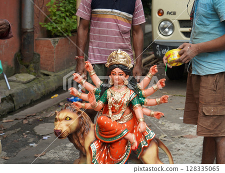Final Touches on a Small Home Durga Idol Before Pandal Setup Final Touches on a Small Home Durga Idol Before Pandal Setup 128335065