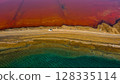 Red salt sea lake, at winter, village Alyki, Boeotia, Greece. 128335114