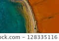 Red salt sea lake, at winter, village Alyki, Boeotia, Greece. 128335116