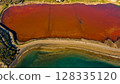Red salt sea lake, at winter, village Alyki, Boeotia, Greece. 128335120