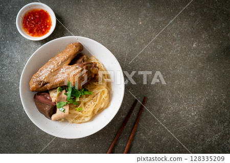 dried noodles with braised duck in white bowl dried noodles with braised duck in white bowl 128335209