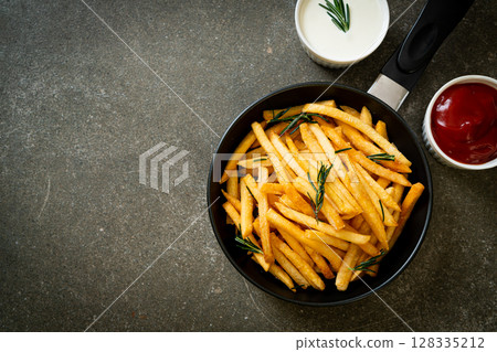 French fries with sour cream and ketchup French fries with sour cream and ketchup 128335212