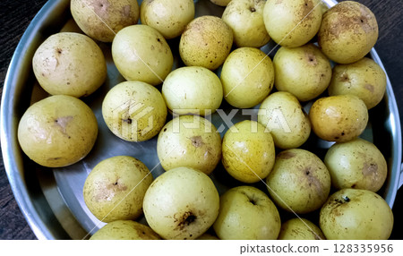 Fresh Amla or Indian Gooseberry in Steel Plate 128335956