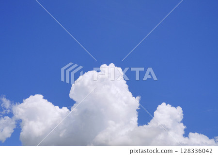 Yokohama cityscape in Japan, with majestic cumulus clouds (bottom of the screen) shining against the blue sky (July 10th) 128336042