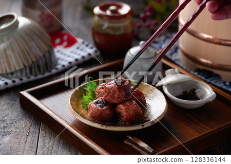 A photo of Kishu Nankou plums with dried bonito plums elegantly arranged on Japanese tableware 128336144