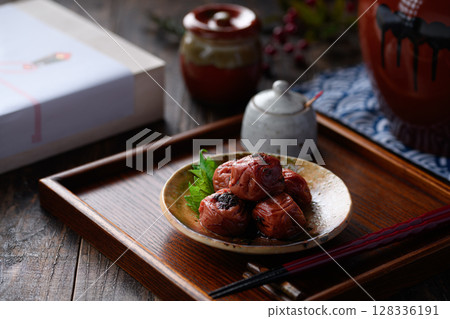 A luxurious Japanese-style presentation of pickled plums with a tranquil Japanese background A luxurious Japanese-style presentation of pickled plums with a tranquil Japanese background 128336191