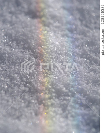 Rainbow is reflected in the snow 128336582