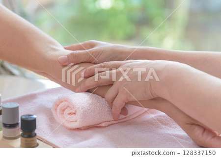 Hand treatment, hand massage, touch care Hand treatment, hand massage, touch care 128337150