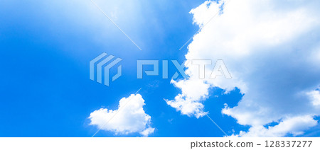Simple skyscape with blue sky and white clouds Simple skyscape with blue sky and white clouds 128337277