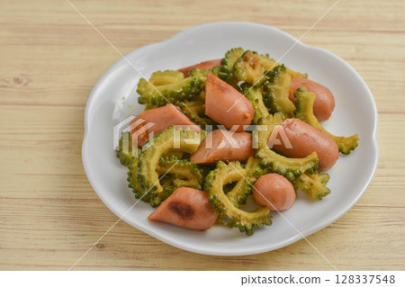 Stir-fried bitter melon and Vienna sausage with curry Stir-fried bitter melon and Vienna sausage with curry 128337548