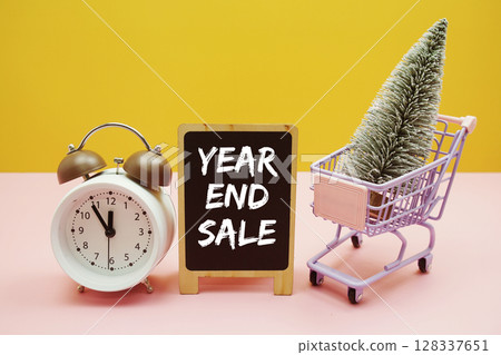 Year End Sale Promotion and Marketing with mini trolley shopping cart and alarm clock Year End Sale Promotion and Marketing with mini trolley shopping cart and alarm clock 128337651