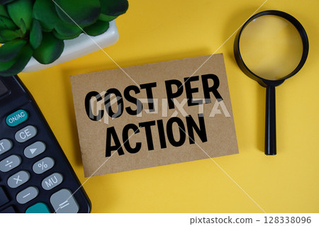 CPA Cost Per Action text with magnifying glass anc calculator on yellow background CPA Cost Per Action text with magnifying glass anc calculator on yellow background 128338096