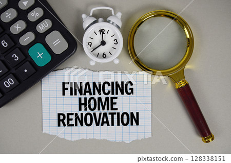 Financing Home Renovation text with alarm clock, magnifying glass anc calculator on gray background 128338151