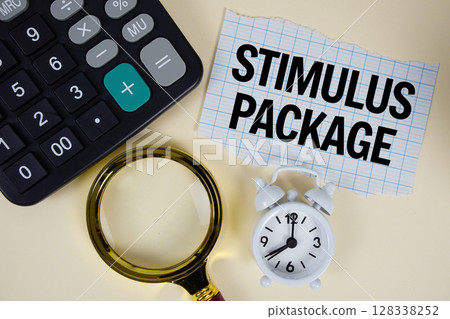 Stimulus Package text with alarm clock, magnifying glass anc calculator on yellow background 128338252