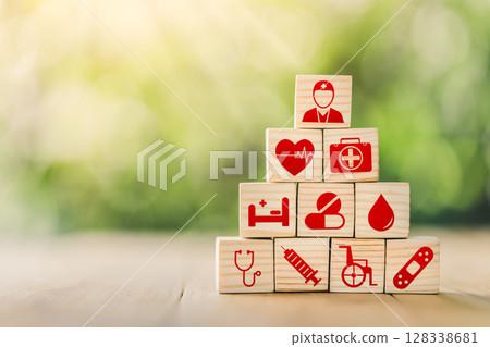 Lay out wooden blocks with icons of medical health. health insurance for your health concept. Healthcare medical business. Lay out wooden blocks with icons of medical health. health insurance for your health concept. Healthcare medical business. 128338681
