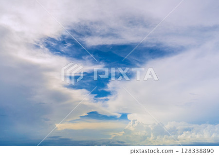 Yokohama cityscape in Japan, with a view of the majestic cumulus clouds (bottom right of the screen) shining against the blue sky (July 10th) 128338890