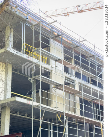 Photo of the building construction process during the day 128339534