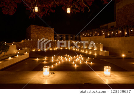 Tranquil Terrace With Candlelight Display Creating a Warm and Romantic Atmosphere 128339627