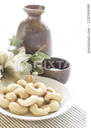 Cashew nuts and sake 128340096