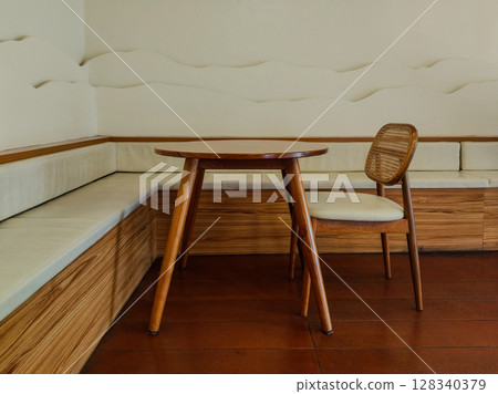 Stylish empty decorative cafe room with wooden set of table and chair Stylish empty decorative cafe room with wooden set of table and chair 128340379