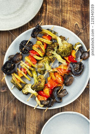 Pile of skewers with vegetables, barbeque. 128340589