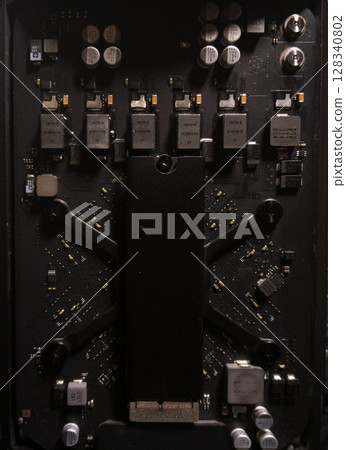 Electronic circuit board with processor and metal components, showing old computer technology in close-up Electronic circuit board with processor and metal components, showing old computer technology in close-up 128340802