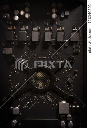 Electronic circuit board with processor and metal components, showing old computer technology in close-up Electronic circuit board with processor and metal components, showing old computer technology in close-up 128340803