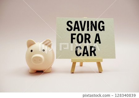 Saving for a Car text and piggy bank for saving on pink background 128340839